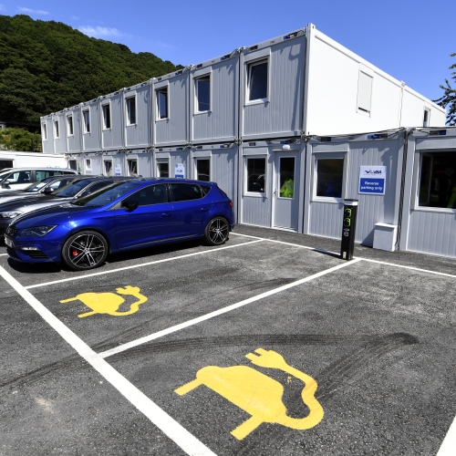 Two story site accommodation units with car park and electric parking bays