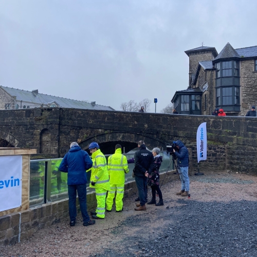 ITV BOrder, Cumberland Council , Kendal Town Council and EA representatives viewing the first glass panels.jpg